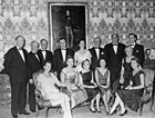 George Currie, second from left, and partners gather at a firm dinner.
