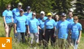 PwC Edmonton takes a quick break during a tree planting event for Green Week