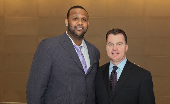 New York Yankees pitcher CC Sabathia (left), poses with Brendan Dougher, Managing Partner of PwC's New York Metro Market, during an event at the firm's Madison Avenue offices where PwC announced it is donating $50,000 to Sabathia's PitCCh In Foundation.
