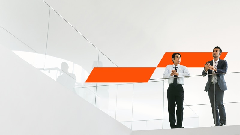 two coworkers working on a computer