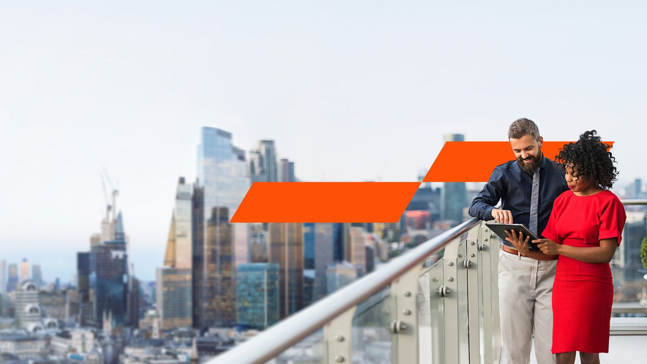 Two people looking at Ipad