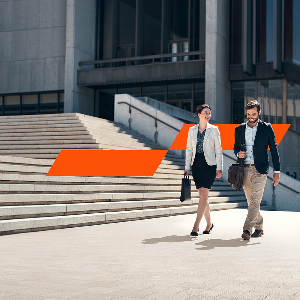 Colleagues chatting in an office space