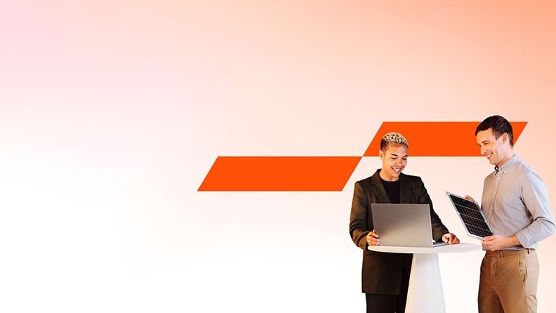 Woman and man looks at laptop