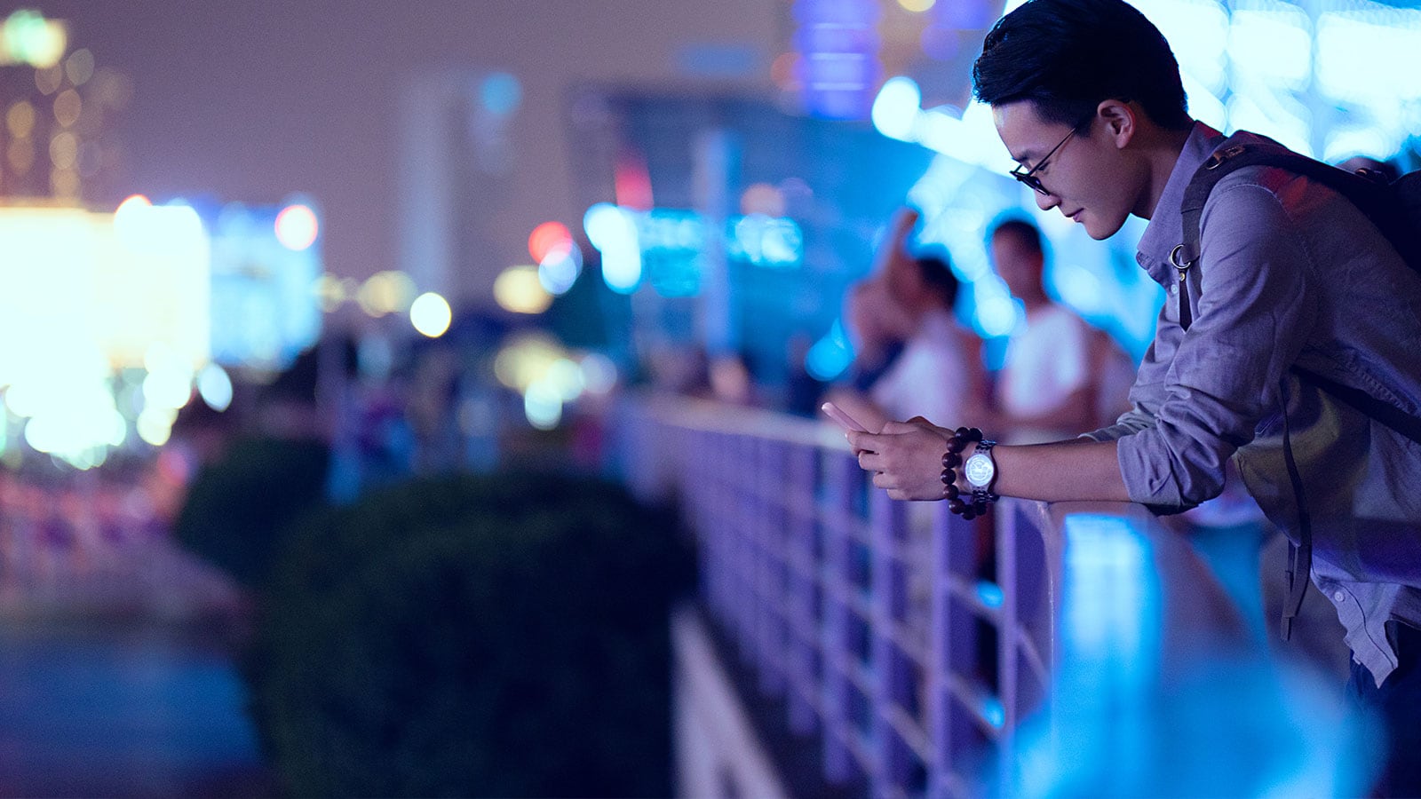 Man looking at his phone in the city