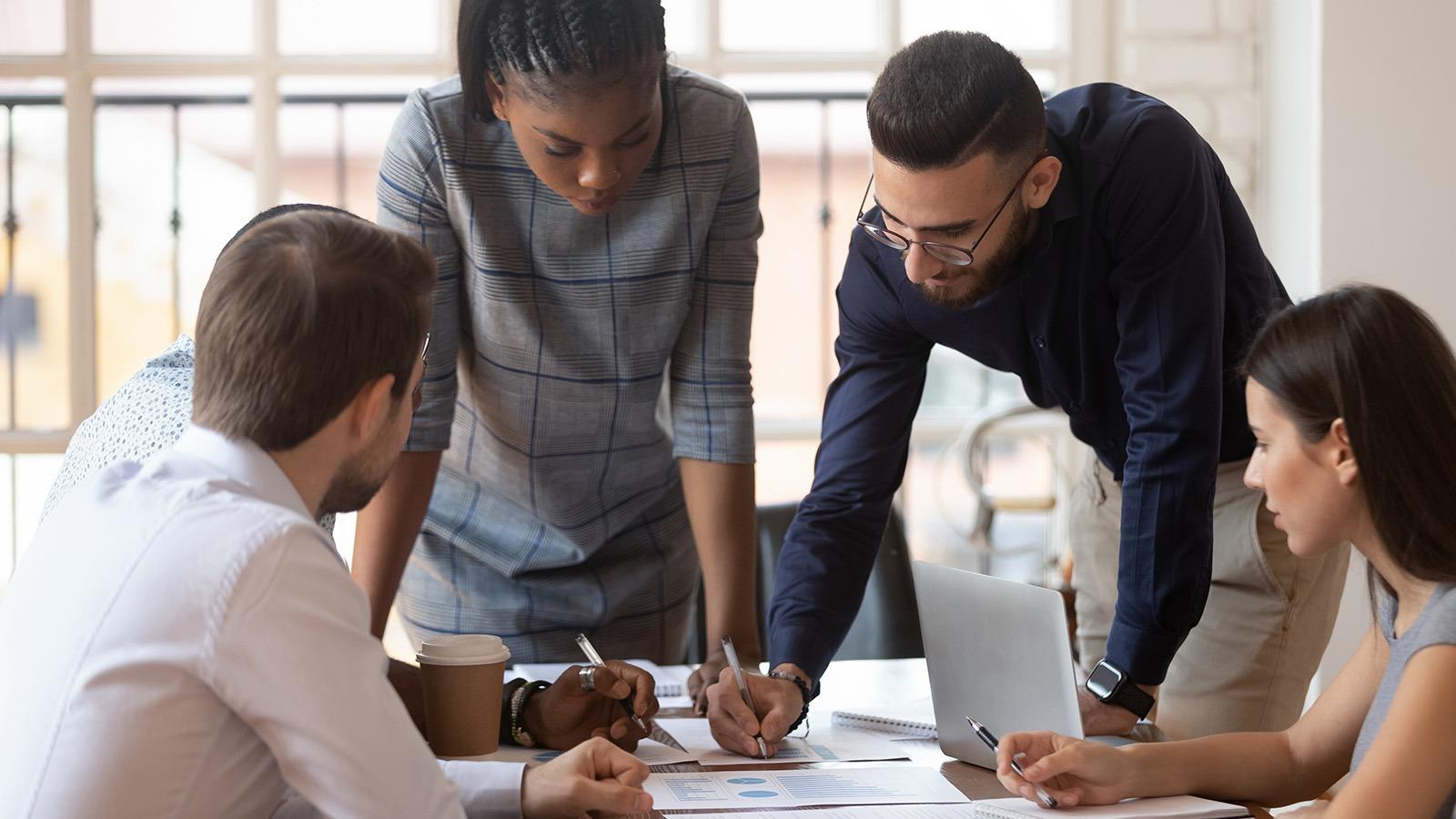 Collegues working together at a desk