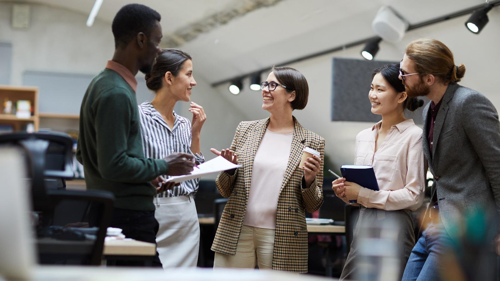 Group of business people chatting in office