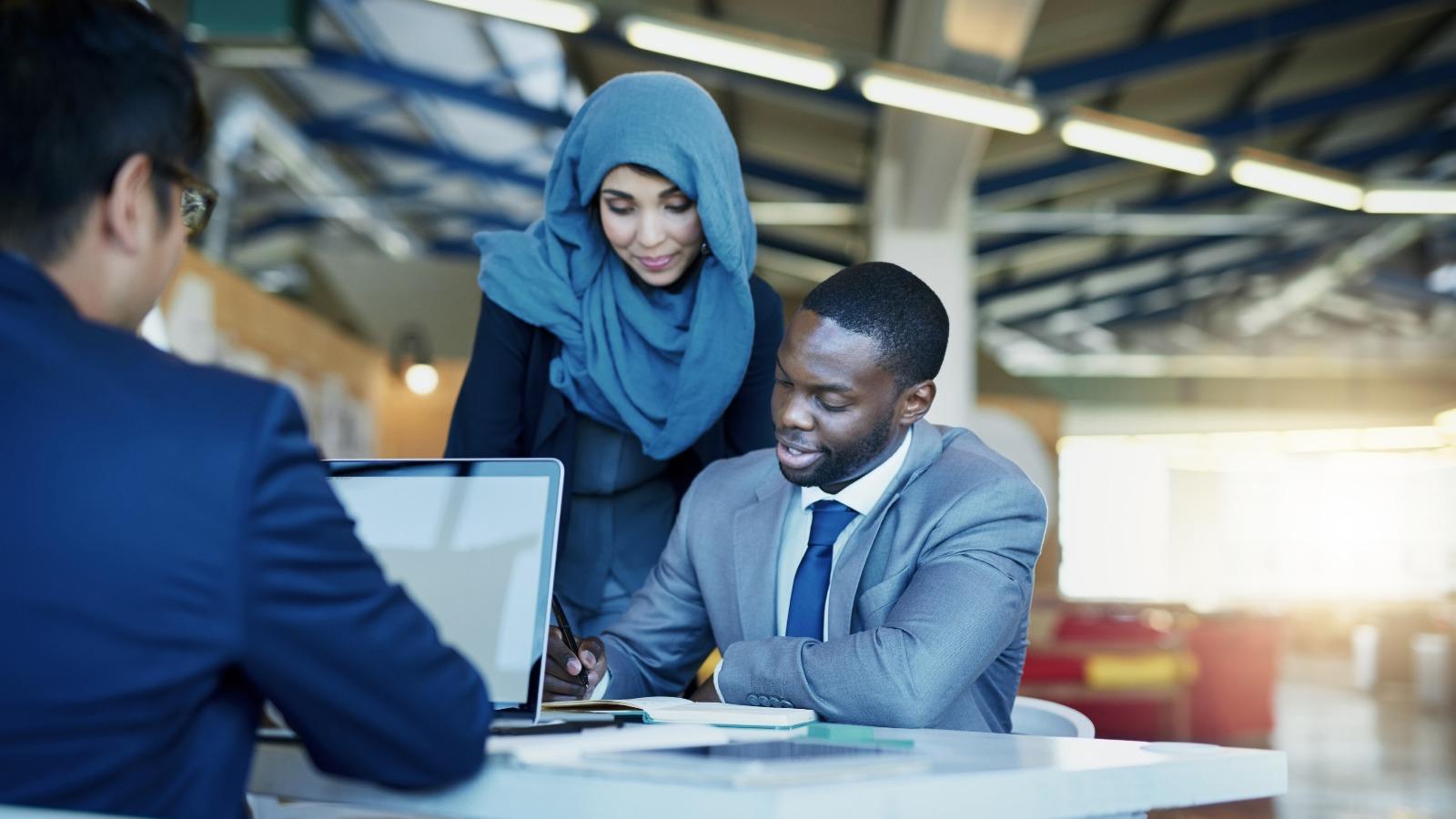 Coworkers talking to one another