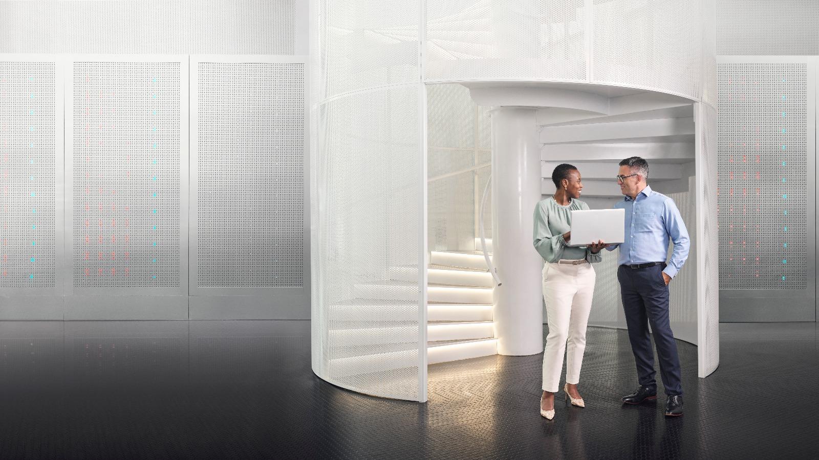 Two colleagues looking at a tablet