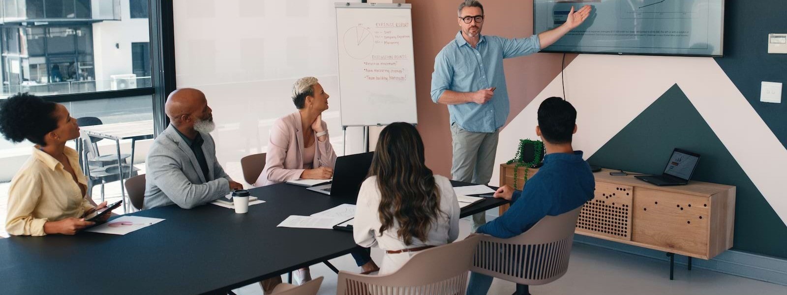Man pointing at a screen