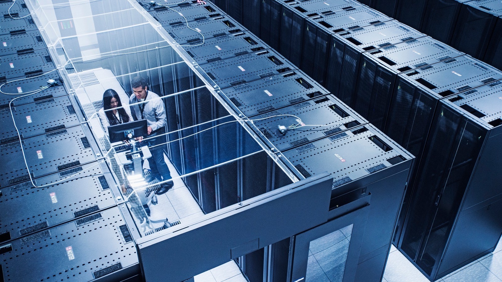 Technicians working in server room