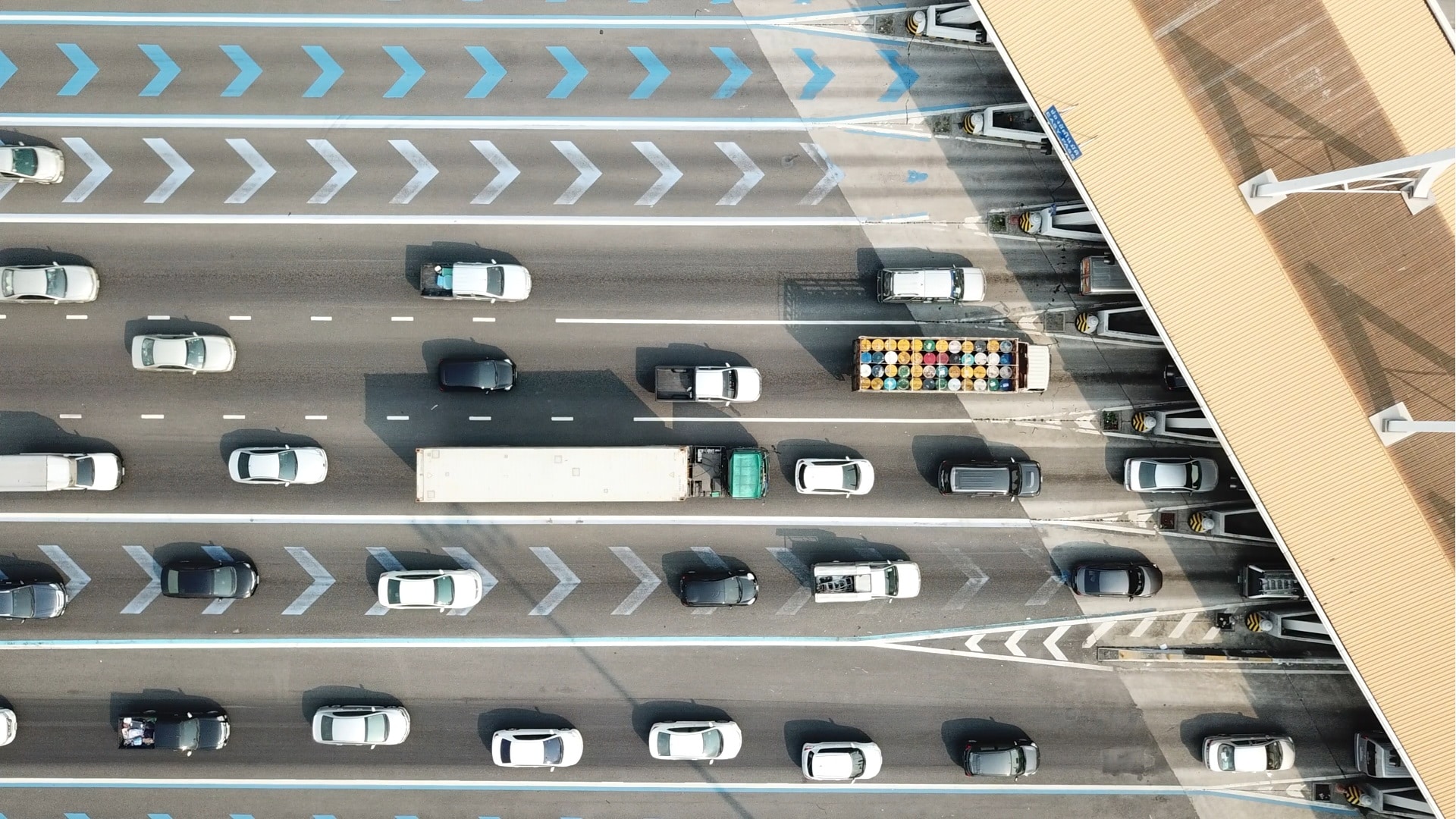 Vehicles approaching a toll or border kiosks - aerial view