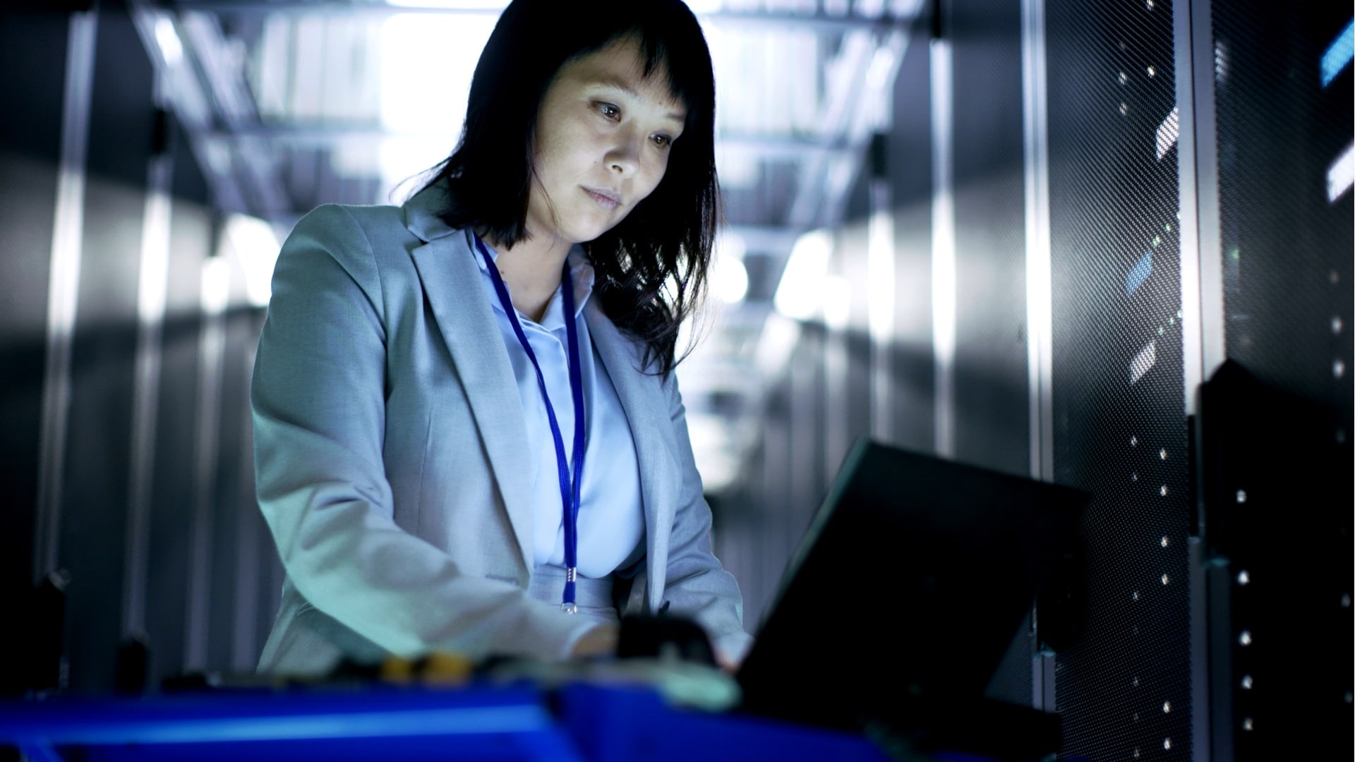 Woman IT Engineer working on a crash cart laptop