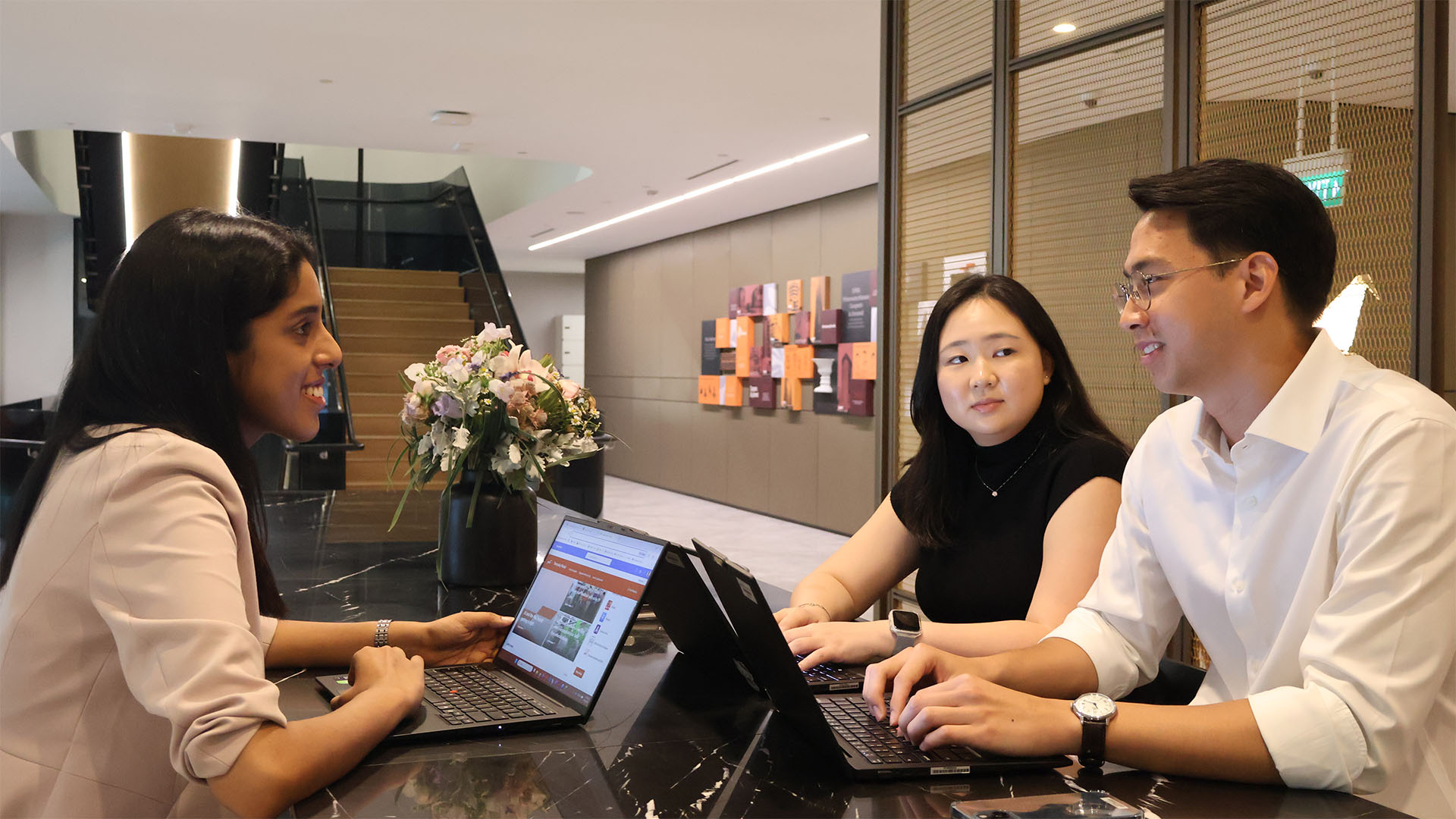 Three colleagues discussing in the office