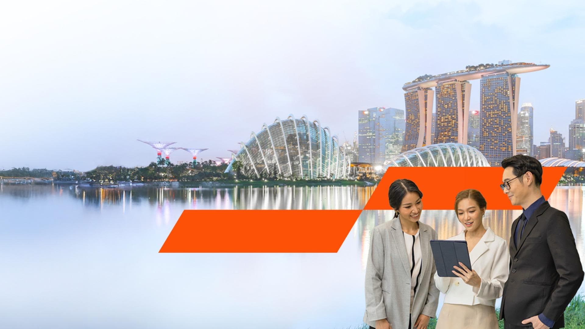 Asian colleagues having a discussion against urban skyline