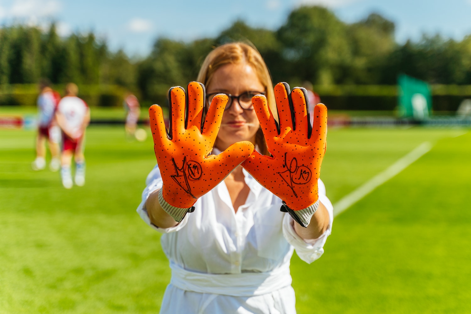 1 woman with football gloves 
