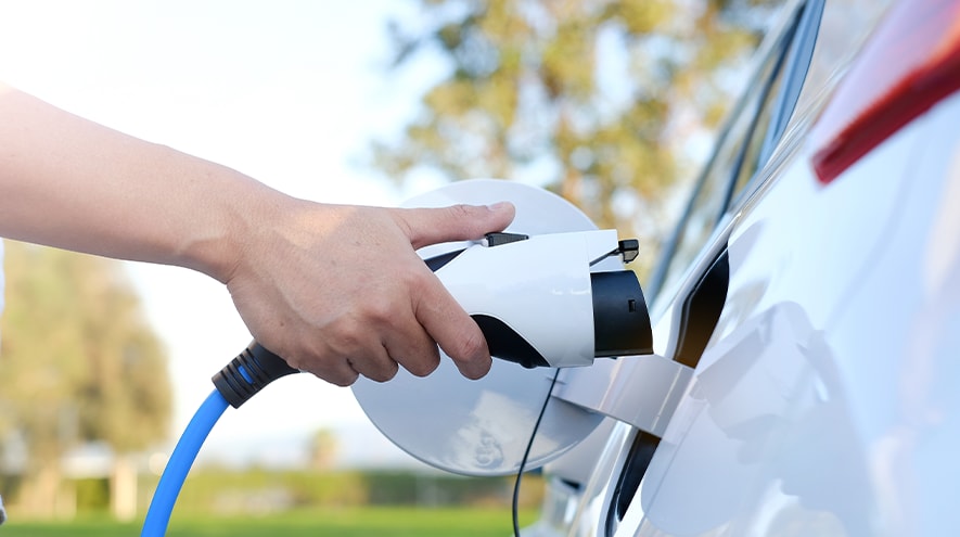 A person charging their car