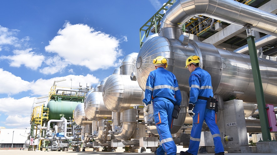 Workers outside a chemical plant