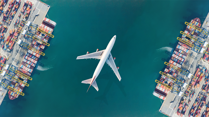 An airplane flying over a port