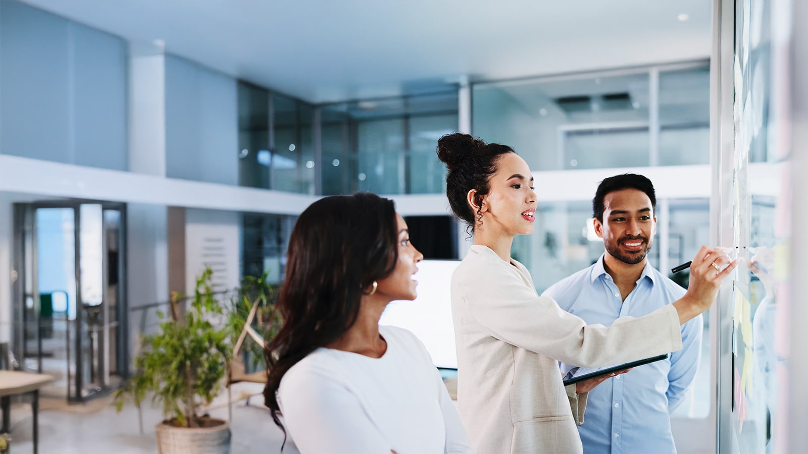 People writing on a board
