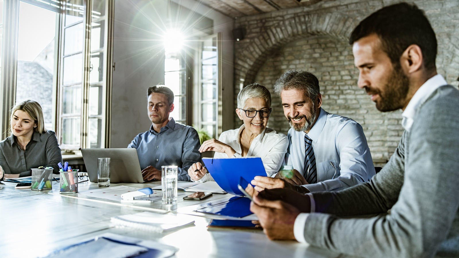 A person taking notes in a meeting